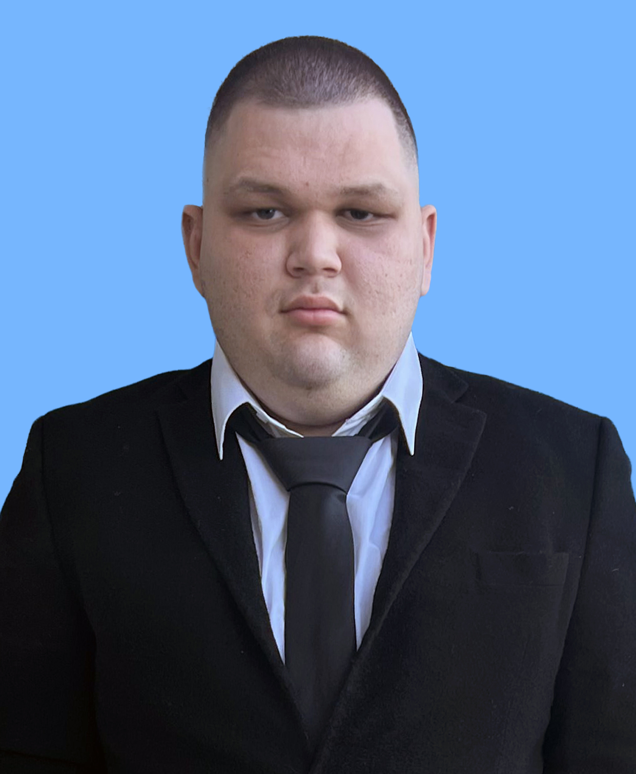 A photo of Pavel Castro, a man with short dark hair, smiling.